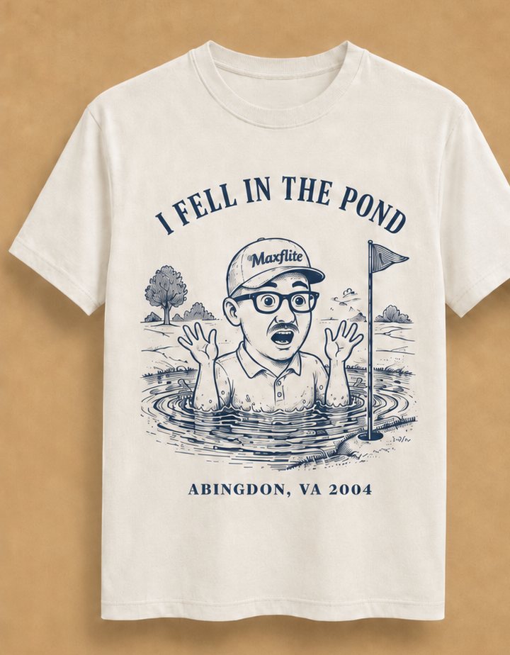 I Fell in the Pond tee — man surfacing in a pond beside the flagstick